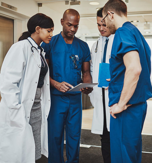 doctors and scribes looking over medical record